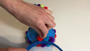 Glue Pom Poms onto Ear DIY Balloon Ears Tutorial by Little Gray Squirrel
