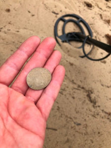Flattened coin found while metal detecting
