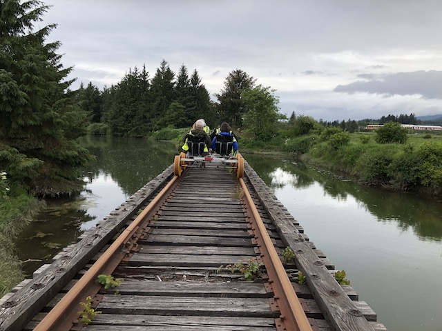 Riders passing over a waterway on an Oregon Coast Railriders trip