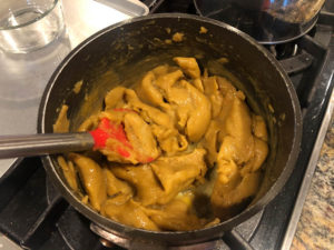 Adding eggs to pumpkin churro paste